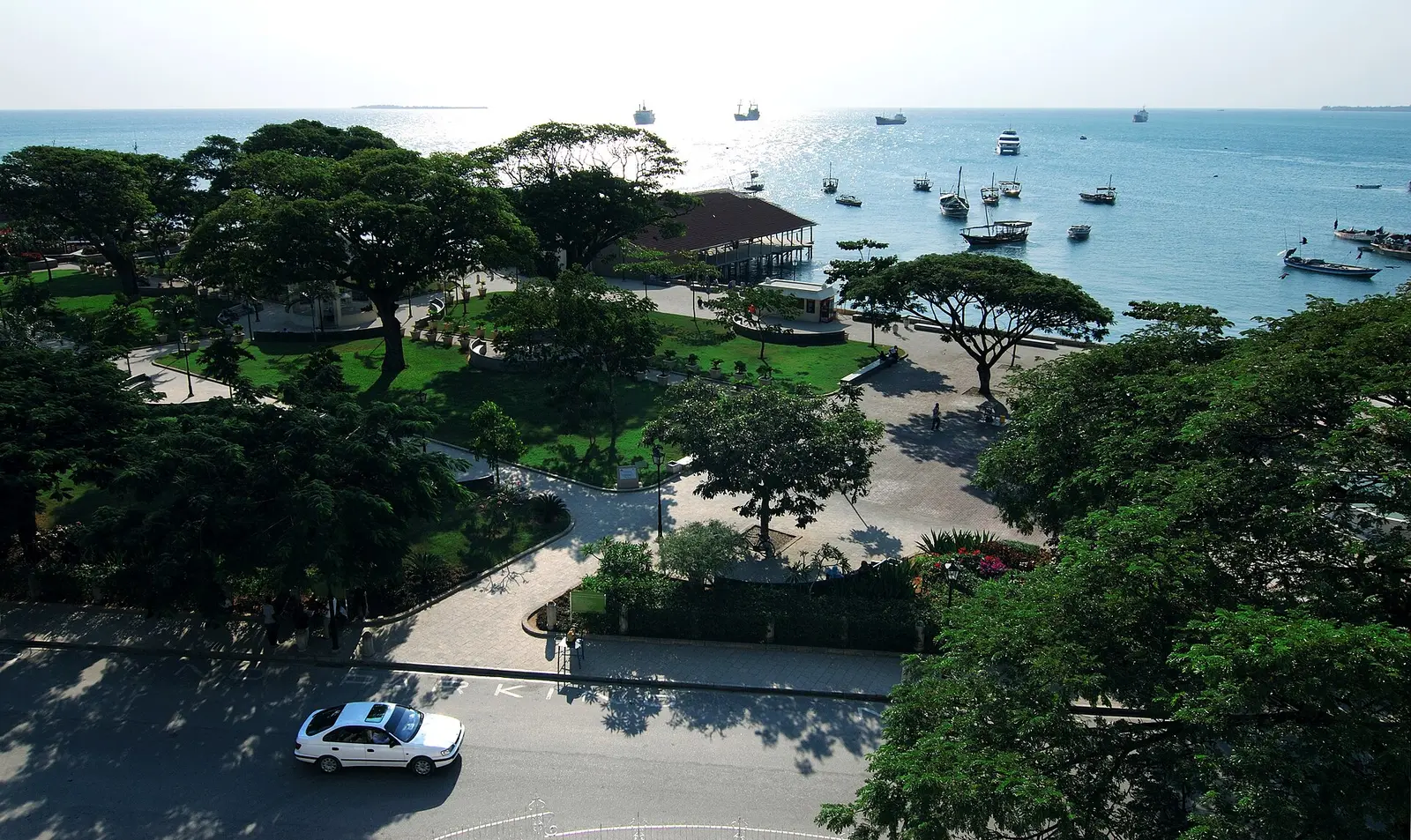 Forodhani Gardens from above, with the Stone Town seafront and boats at anchor