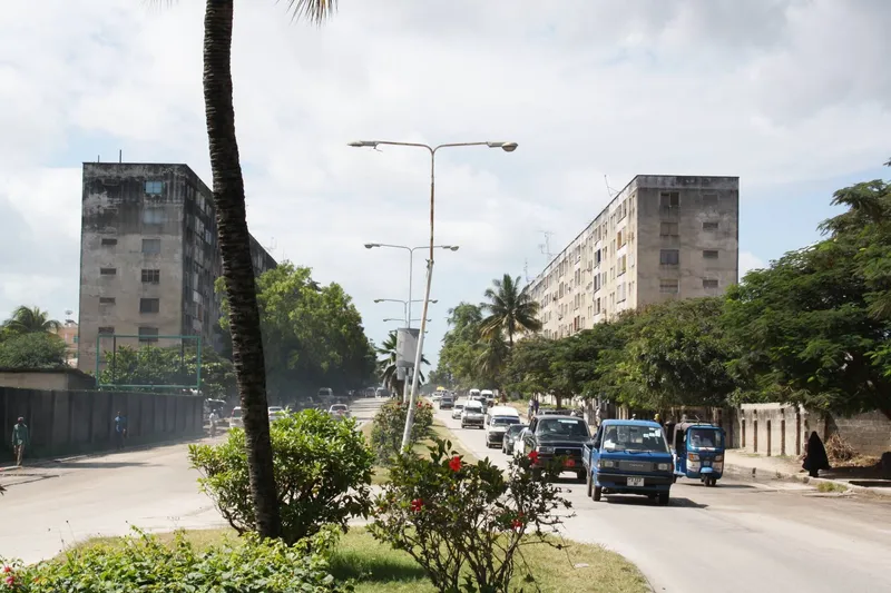 East German-built apartment blocks along a road in Michenzani, Zanzibar Town