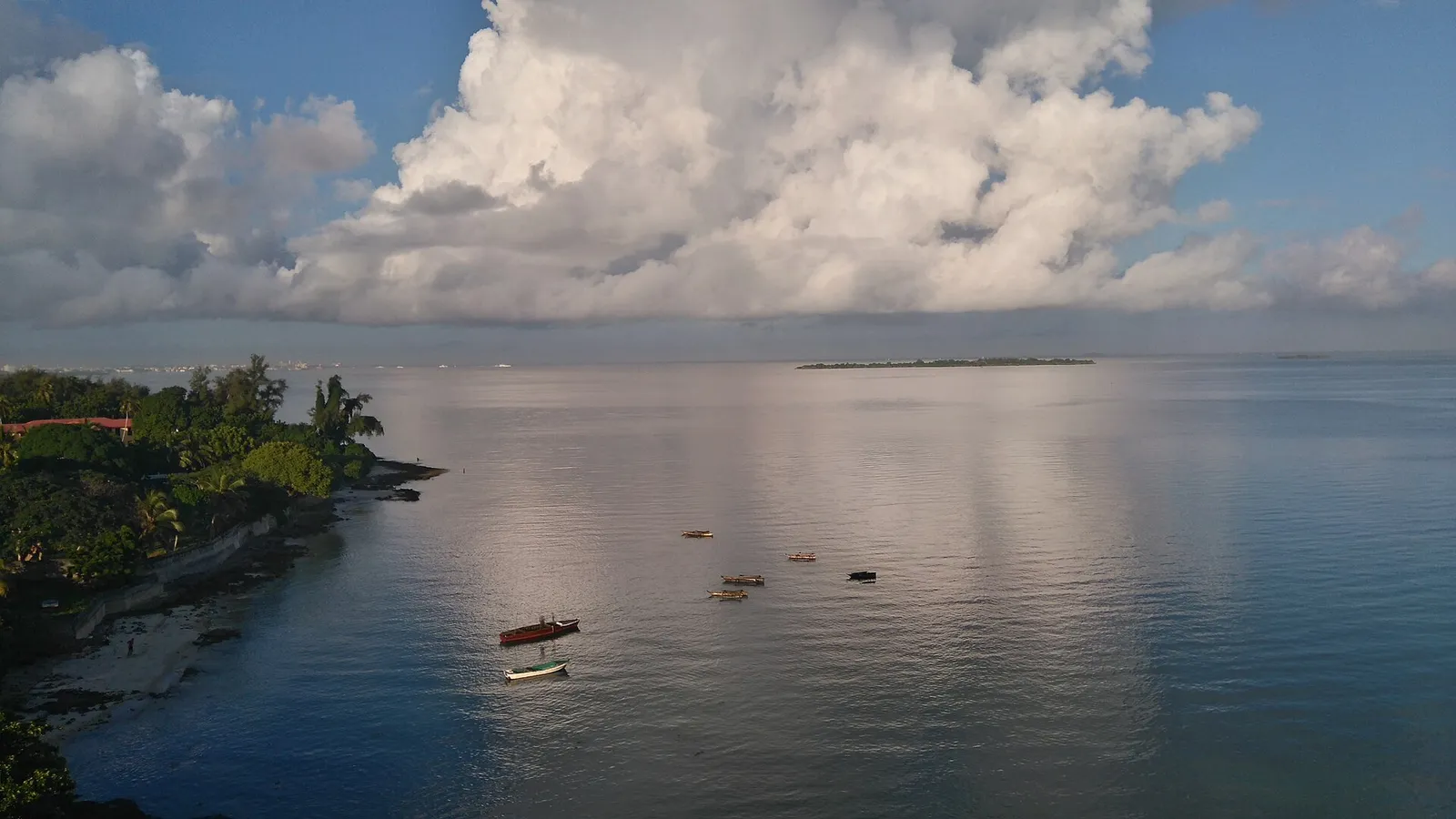Small fishing boats on calm water off the coast at Bububu, north of Stone Town